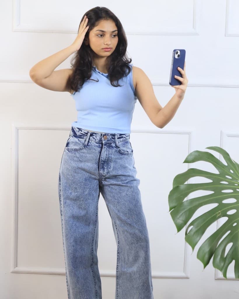 Model in acid-wash denim taking a selfie, Lynx Sri Lanka online ordering